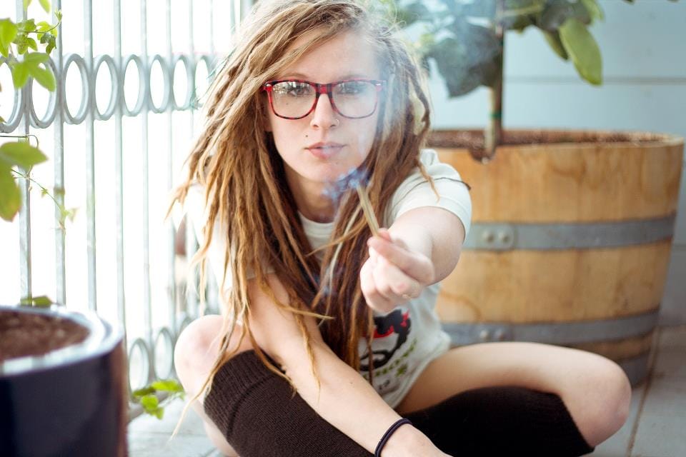 Sexy girl smoking with glasses