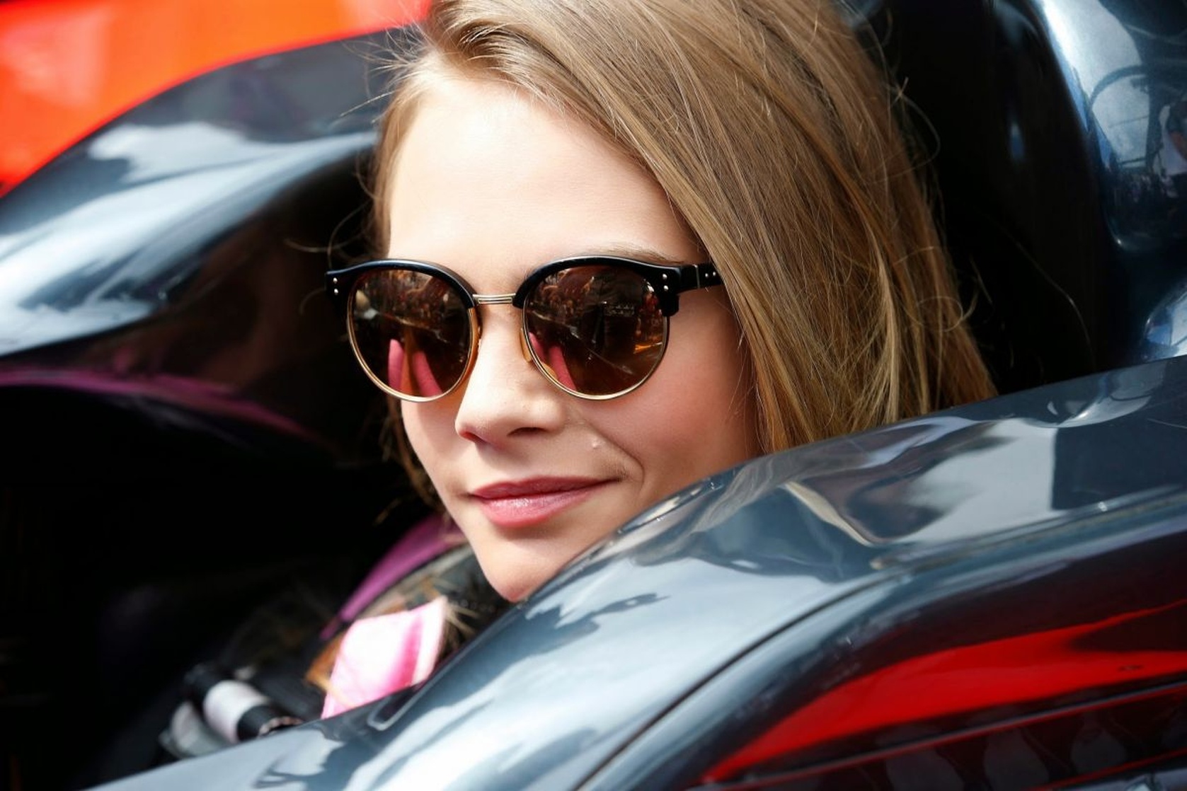 CARA DELEVINGNE at McLaren Honda Garage in Pitlane