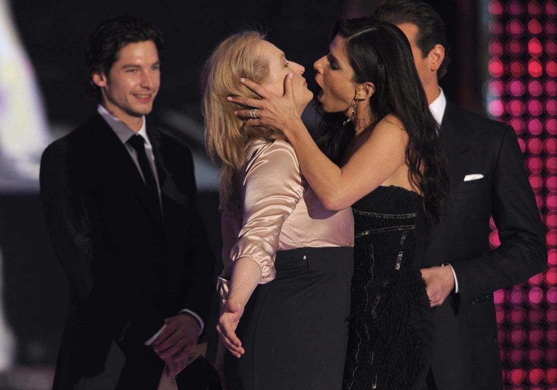 Meryl Streep and Sandra Bullock get ready to kiss on stage 15th Annual Crit...